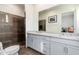 Spacious bathroom with double vanity sinks and a tiled walk-in shower at 4438 N 27Th St # 24, Phoenix, AZ 85016