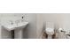 Bathroom features a pedestal sink with polished chrome faucet and a white toilet at 4438 N 27Th St # 24, Phoenix, AZ 85016