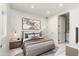 Cozy bedroom with neutral tones, a stylish area rug, and framed art over the bed at 4438 N 27Th St # 24, Phoenix, AZ 85016
