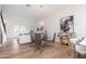 Open-concept dining area with a glass-top table, stylish chairs, and modern chandelier lighting at 4438 N 27Th St # 24, Phoenix, AZ 85016