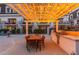 Outdoor patio featuring a dining table, chairs, grill, and overhead string lights at 4438 N 27Th St # 24, Phoenix, AZ 85016