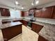 Spacious kitchen featuring modern appliances and a functional center island at 4669 E Sierrita Rd, San Tan Valley, AZ 85143