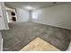 Spacious living room with neutral carpet and natural light from a bright window at 4669 E Sierrita Rd, San Tan Valley, AZ 85143