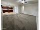 Open-concept living space with carpet and view to kitchen at 4669 E Sierrita Rd, San Tan Valley, AZ 85143