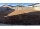 Large backyard with block wall, ready for landscaping and outdoor activities at 46940 W Coe St, Maricopa, AZ 85139