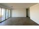 Bright living room featuring sliding glass doors to the backyard and hardwood flooring at 46940 W Coe St, Maricopa, AZ 85139