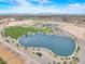 Aerial view featuring a community lake and park at 5172 S Seton Ave, Gilbert, AZ 85298