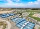 Aerial view of the community pickle ball courts, park and lake at 5172 S Seton Ave, Gilbert, AZ 85298