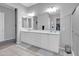 Bright bathroom featuring a double sink vanity with white cabinets and gray walls at 5172 S Seton Ave, Gilbert, AZ 85298