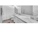 Bathroom with a white dual sink vanity, modern fixtures, and a shower-tub combo at 5172 S Seton Ave, Gilbert, AZ 85298