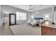 Well-lit primary bedroom with neutral colors, carpet, and a ceiling fan at 5172 S Seton Ave, Gilbert, AZ 85298