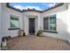 Inviting courtyard entrance with elegant door, tile flooring, and string lights above at 5172 S Seton Ave, Gilbert, AZ 85298