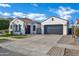 Beautiful single-story home featuring a spacious driveway, desert landscaping, and an attached garage at 5172 S Seton Ave, Gilbert, AZ 85298