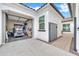 A two car garage space holds a golf cart and bicycles at 5172 S Seton Ave, Gilbert, AZ 85298