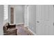 Hallway with wood floors, neutral walls, decorative rug and growth chart at 5172 S Seton Ave, Gilbert, AZ 85298
