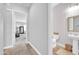 Hallway leading to a powder room and primary bedroom at 5172 S Seton Ave, Gilbert, AZ 85298