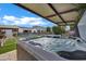 Inviting in-ground hot tub under a covered patio, perfect for relaxing and entertaining with backyard pool in background at 5172 S Seton Ave, Gilbert, AZ 85298