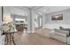 Open-concept living area featuring Herringbone floors and multiple seating areas at 5172 S Seton Ave, Gilbert, AZ 85298