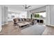 Open concept living room with kitchen view, large sofa, and a bright airy feel at 5172 S Seton Ave, Gilbert, AZ 85298