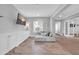 Bright living room boasts Herringbone wood floors, sectional sofa, and built-in cabinets at 5172 S Seton Ave, Gilbert, AZ 85298