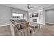 Comfortable living room featuring a fireplace, built-in shelving, and a large sliding glass door at 5172 S Seton Ave, Gilbert, AZ 85298
