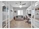 Home office with wood floors, built in bookshelves, modern desk setup, and comfortable seating at 5172 S Seton Ave, Gilbert, AZ 85298