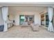 Covered patio with comfortable seating, sliding glass doors, and view of backyard at 5172 S Seton Ave, Gilbert, AZ 85298