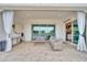 Covered patio with comfortable seating, sliding glass doors, and view of backyard at 5172 S Seton Ave, Gilbert, AZ 85298