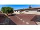 Manicured backyard featuring unique desert landscaping, offering a low-maintenance and serene outdoor retreat at 6409 E Duncan St, Mesa, AZ 85205