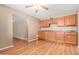 Dining room with wood floors, ceiling fan, and built-in cabinets at 6409 E Duncan St, Mesa, AZ 85205