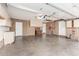Spacious two-car garage with brick walls and ample storage cabinets, ideal for organization at 6409 E Duncan St, Mesa, AZ 85205