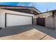 Charming home exterior featuring a white garage door and desert landscaping, boosting curb appeal at 6409 E Duncan St, Mesa, AZ 85205