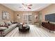 Bright living room with slider to outdoor patio and neutral decor at 6409 E Duncan St, Mesa, AZ 85205