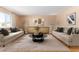 Staged living room with neutral paint, plush rug, and ample seating at 6409 E Duncan St, Mesa, AZ 85205