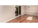 Living area with slider to exterior; neutral paint and hard surface floors at 6409 E Duncan St, Mesa, AZ 85205
