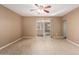 Empty living room features ceramic tile floors and sliding glass doors to the outside at 6409 E Duncan St, Mesa, AZ 85205