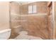 Walk-in shower with glass doors and decorative tile at 6409 E Duncan St, Mesa, AZ 85205