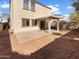 Expansive backyard includes a covered patio, providing shade, and a spacious open area at 7009 W Lincoln St, Peoria, AZ 85345