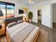 Cozy bedroom with large window, stylish furniture, and a walk-in closet for ample storage at 7009 W Lincoln St, Peoria, AZ 85345