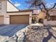 Charming home featuring a well-manicured lawn, a two-car garage, and stylish architecture at 7009 W Lincoln St, Peoria, AZ 85345