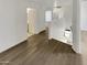 Hallway showcasing modern flooring, neutral paint, and seamless access to various rooms within the house at 7009 W Lincoln St, Peoria, AZ 85345