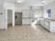 Modern kitchen with stainless steel appliances, ample cabinet space, and convenient pantry access at 7009 W Lincoln St, Peoria, AZ 85345