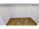 An empty walk-in closet featuring shelving and ample space for storage, providing an organizational haven at 7009 W Lincoln St, Peoria, AZ 85345
