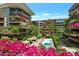 An aerial view of a community with blooming flowers and a refreshing pool. A vibrant and colorful community! at 7147 E Rancho Vista Dr # 4007, Scottsdale, AZ 85251