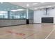 Spacious basketball court with hardwood floors, basketball hoop, and natural lighting at 7147 E Rancho Vista Dr # 4007, Scottsdale, AZ 85251