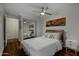 Clean and modern bedroom with a comfortable queen-size bed and hardwood floors at 7147 E Rancho Vista Dr # 4007, Scottsdale, AZ 85251