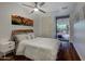 Comfortable bedroom with a queen-size bed and access to a private patio at 7147 E Rancho Vista Dr # 4007, Scottsdale, AZ 85251