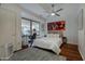 Bedroom featuring a bed and office space, with hardwood floors and a modern ceiling fan at 7147 E Rancho Vista Dr # 4007, Scottsdale, AZ 85251