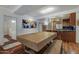 Open-concept kitchen with wood cabinets, stainless steel appliances, breakfast bar, and large dining table at 7147 E Rancho Vista Dr # 4007, Scottsdale, AZ 85251