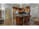 Modern kitchen featuring granite counters, wood cabinetry, and a stainless steel refrigerator at 7147 E Rancho Vista Dr # 4007, Scottsdale, AZ 85251